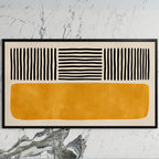 Abstract lines and color block art on a black TV on a white marble wall