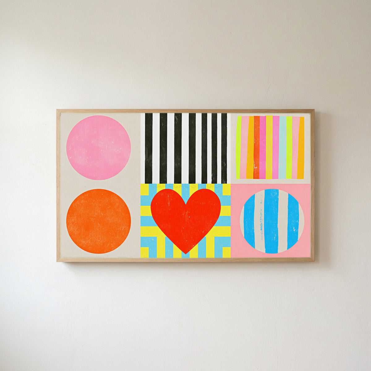 Colorful shapes and heart Frame TV art in an oak frame on a warm white wall