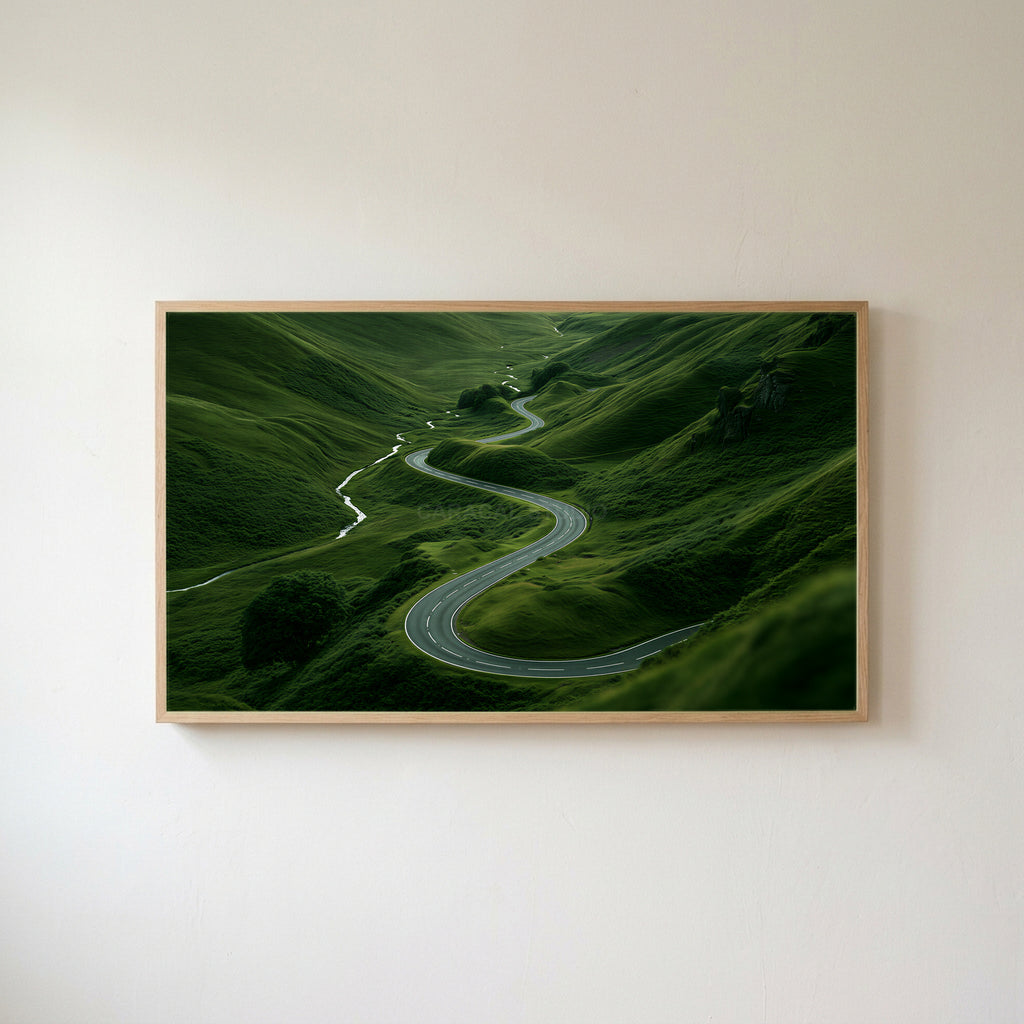 Winding road landscape Frame TV art in an oak frame on a warm white wall