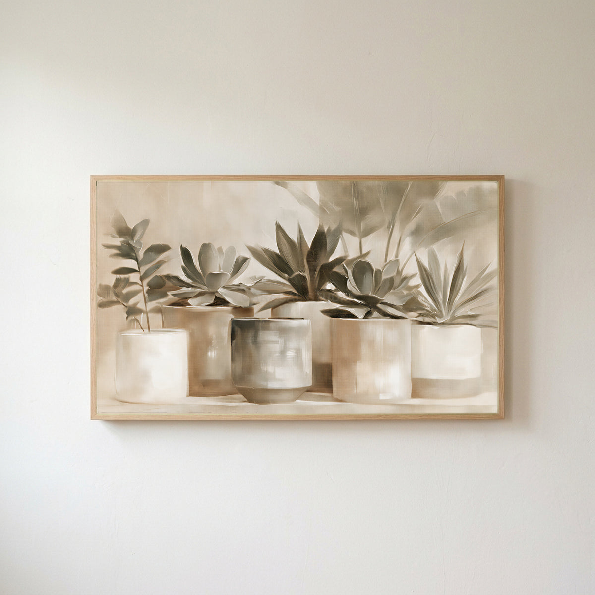 Neutral succulent pots Frame TV art in an oak frame on a warm white wall