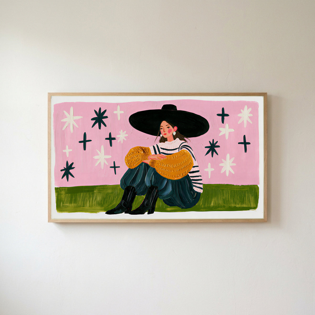 Woman in a big hat Frame TV art in an oak frame on a warm white wall