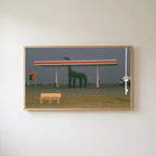 Foggy gas station Frame TV art in an oak frame on a warm white wall