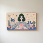 Astrology and cats Frame TV art in an oak frame on a warm white wall