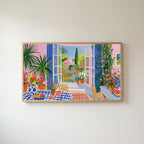 Mediterranean garden view Frame TV art in an oak frame on a warm white wall