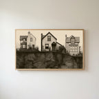 Three houses Frame TV art in an oak frame on a warm white wall