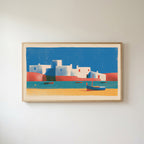 Mediterranean village Frame TV art in an oak frame on a warm white wall