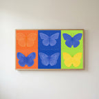 Pop art butterfly Frame TV art in an oak frame on a warm white wall