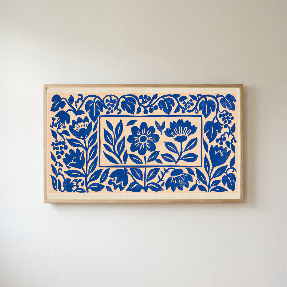 Blue paper cut flowers Frame TV art in an oak frame on a warm white wall