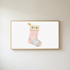 Cat stocking Frame TV art in an oak frame on a warm white wall