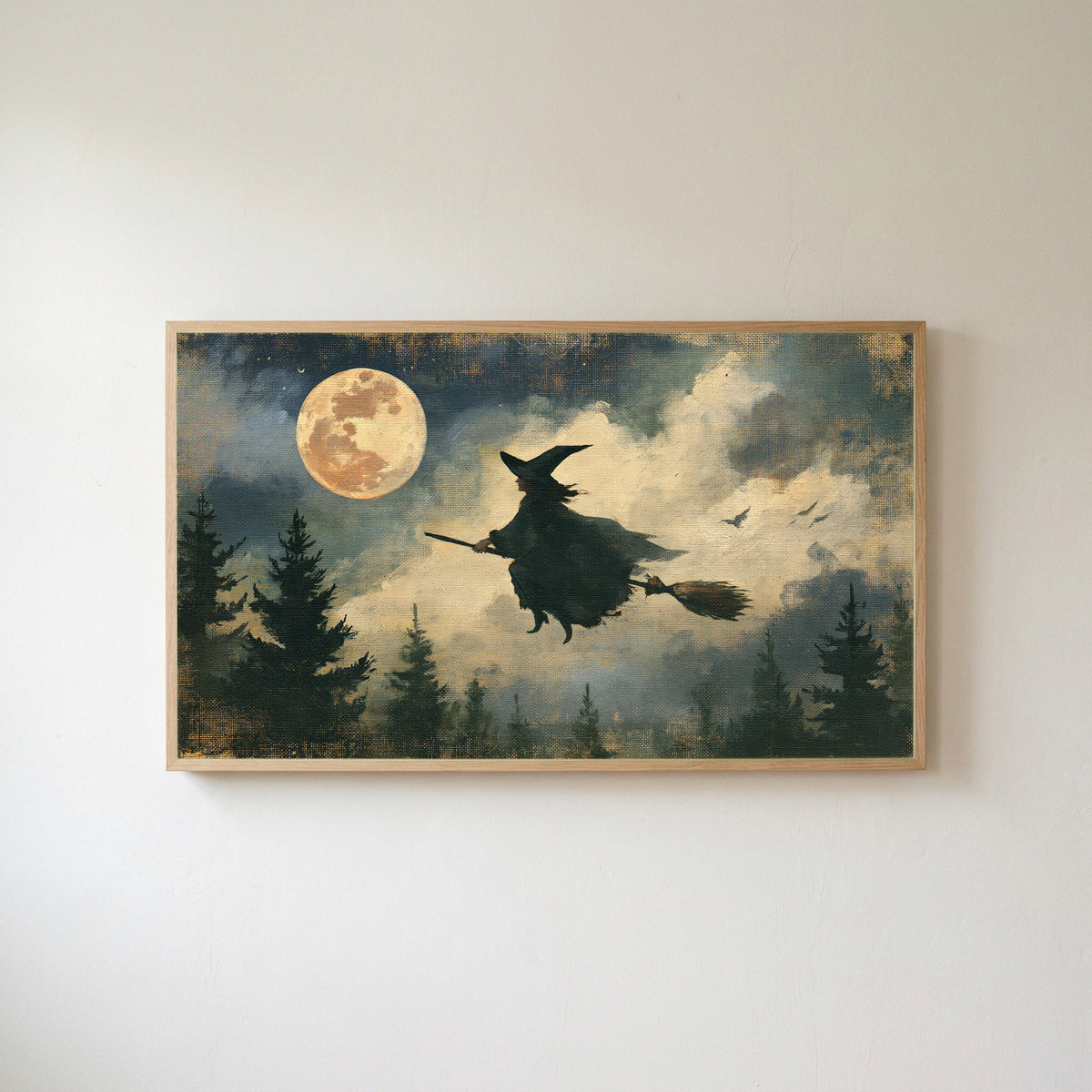 Flying witch Frame TV art in an oak frame on a warm white wall
