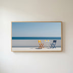 Ocean view terrace Frame TV art in an oak frame on a warm white wall