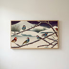 Songbirds on snowy branches Frame TV art in an oak frame on a warm white wall