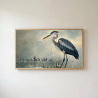 Blue heron Frame TV art in an oak frame on a warm white wall