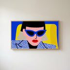 Pop art woman in sunglasses Frame TV art in an oak frame on a warm white wall