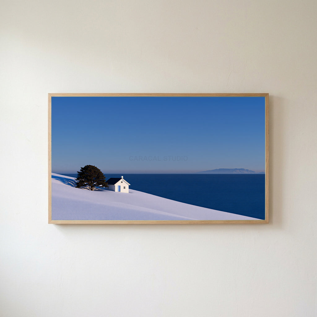 Snowy seaside cottage Frame TV art in an oak frame on a warm white wall