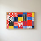 Polka dot patchwork Frame TV art in an oak frame on a warm white wall
