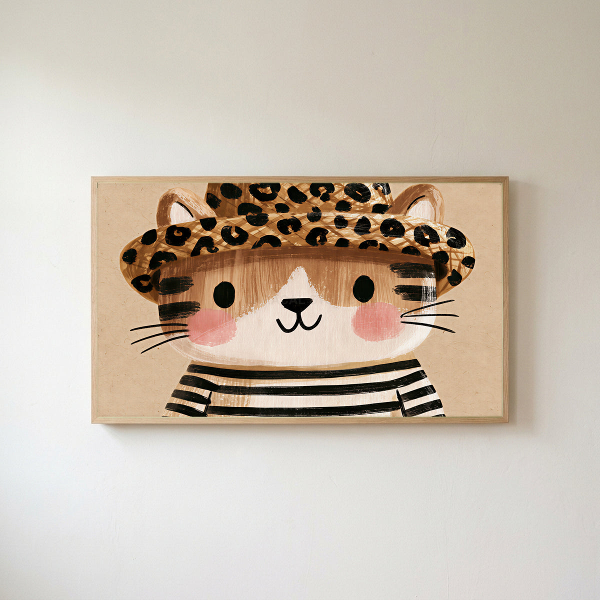 Kitten in a leopard hat Frame TV art in an oak frame on a warm white wall