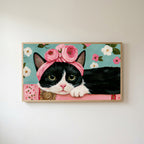 Cat with a flower crown Frame TV art in an oak frame on a warm white wall