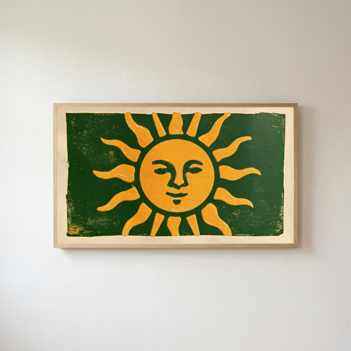 Woodblock sun Frame TV art in an oak frame on a warm white wall