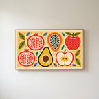 Colorful fruit halves Frame TV art in an oak frame on a warm white wall