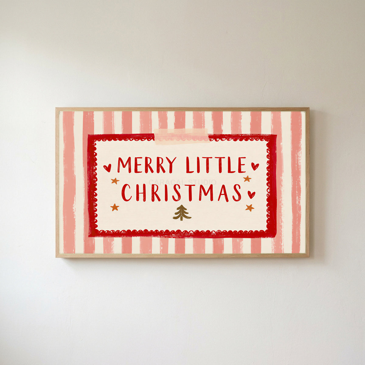Merry Little Christmas Frame TV art in an oak frame on a warm white wall