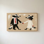 Badger bride and groom Frame TV art in an oak frame on a warm white wall