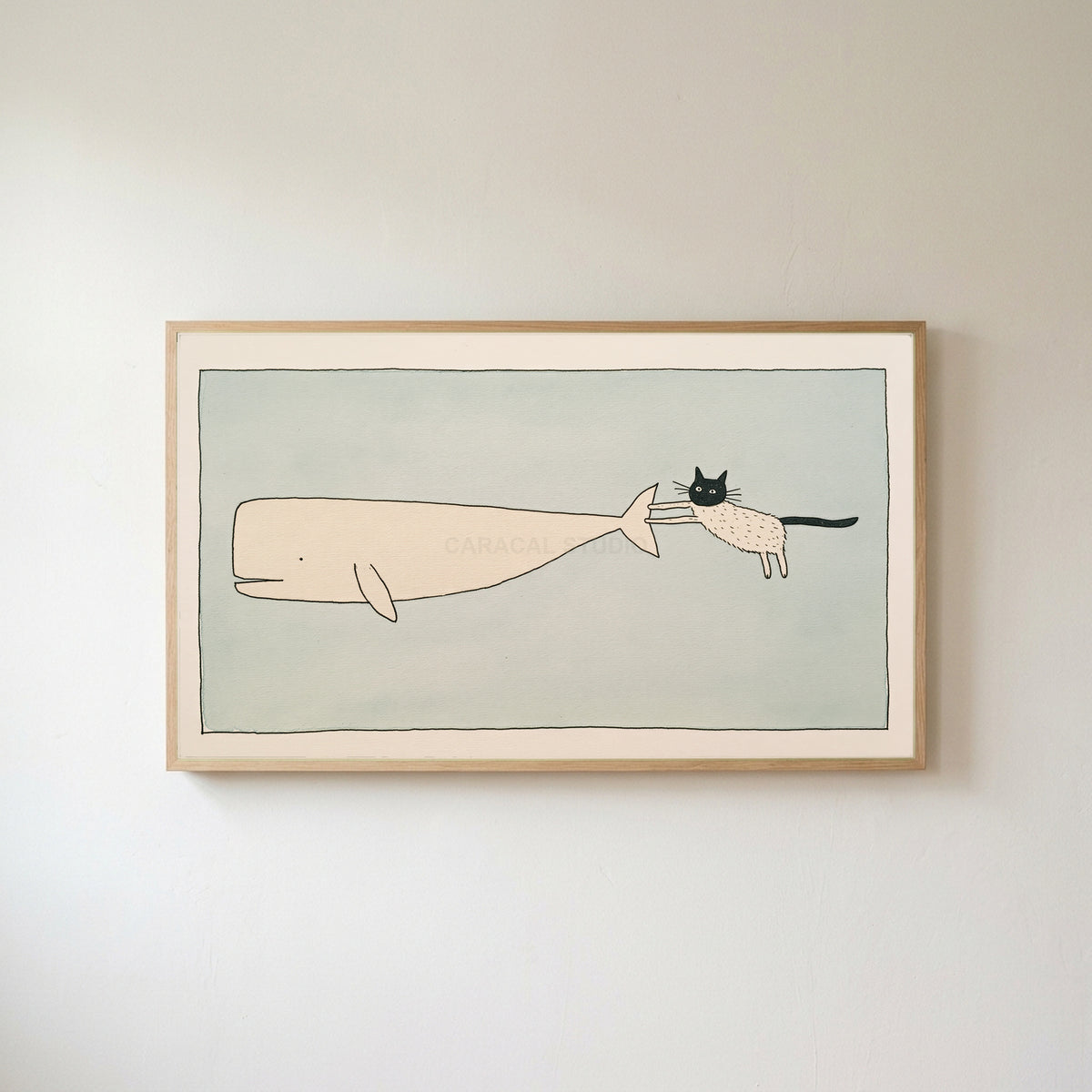 Cat and whale Frame TV art in an oak frame on a warm white wall