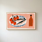 Sardines and tomatoes Frame TV art in an oak frame on a warm white wall