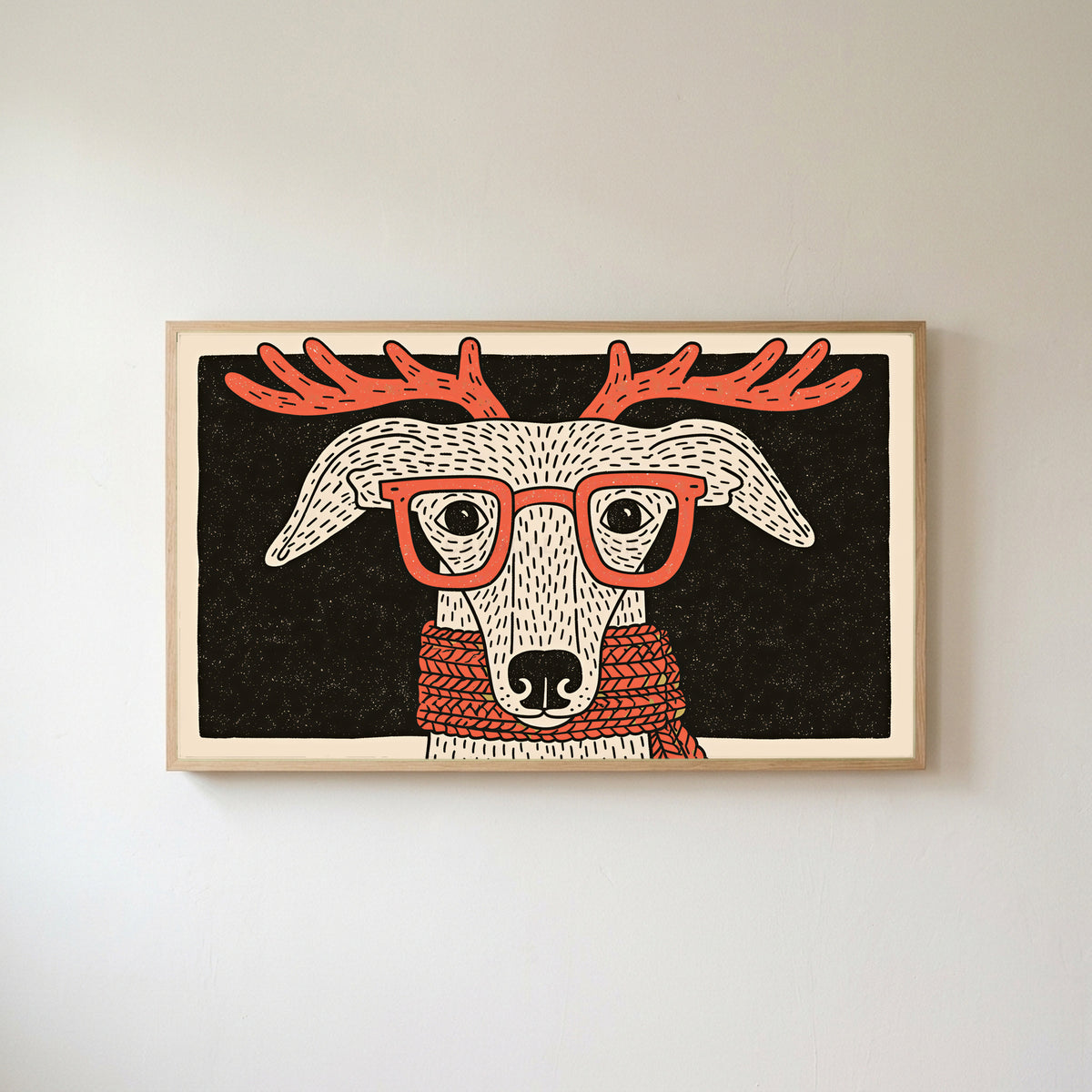 Whippet with reindeer antlers Frame TV art in an oak frame on a warm white wall