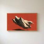 Flying ghost Frame TV art in an oak frame on a warm white wall