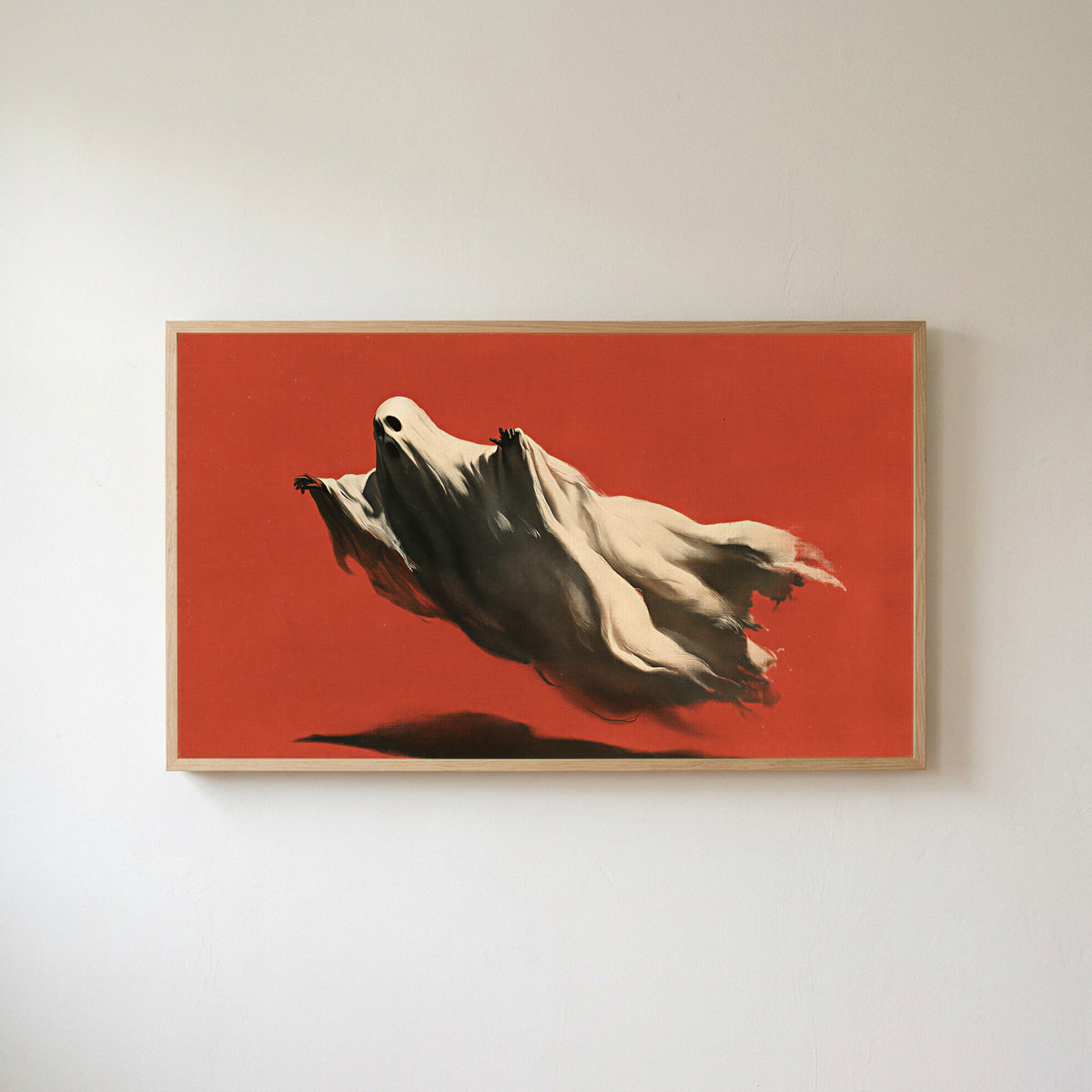 Flying ghost Frame TV art in an oak frame on a warm white wall