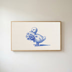 Duckling Frame TV art in an oak frame on a warm white wall