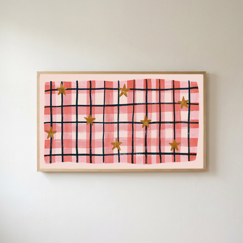 Gingham plaid with stars Frame TV art in an oak frame on a warm white wall