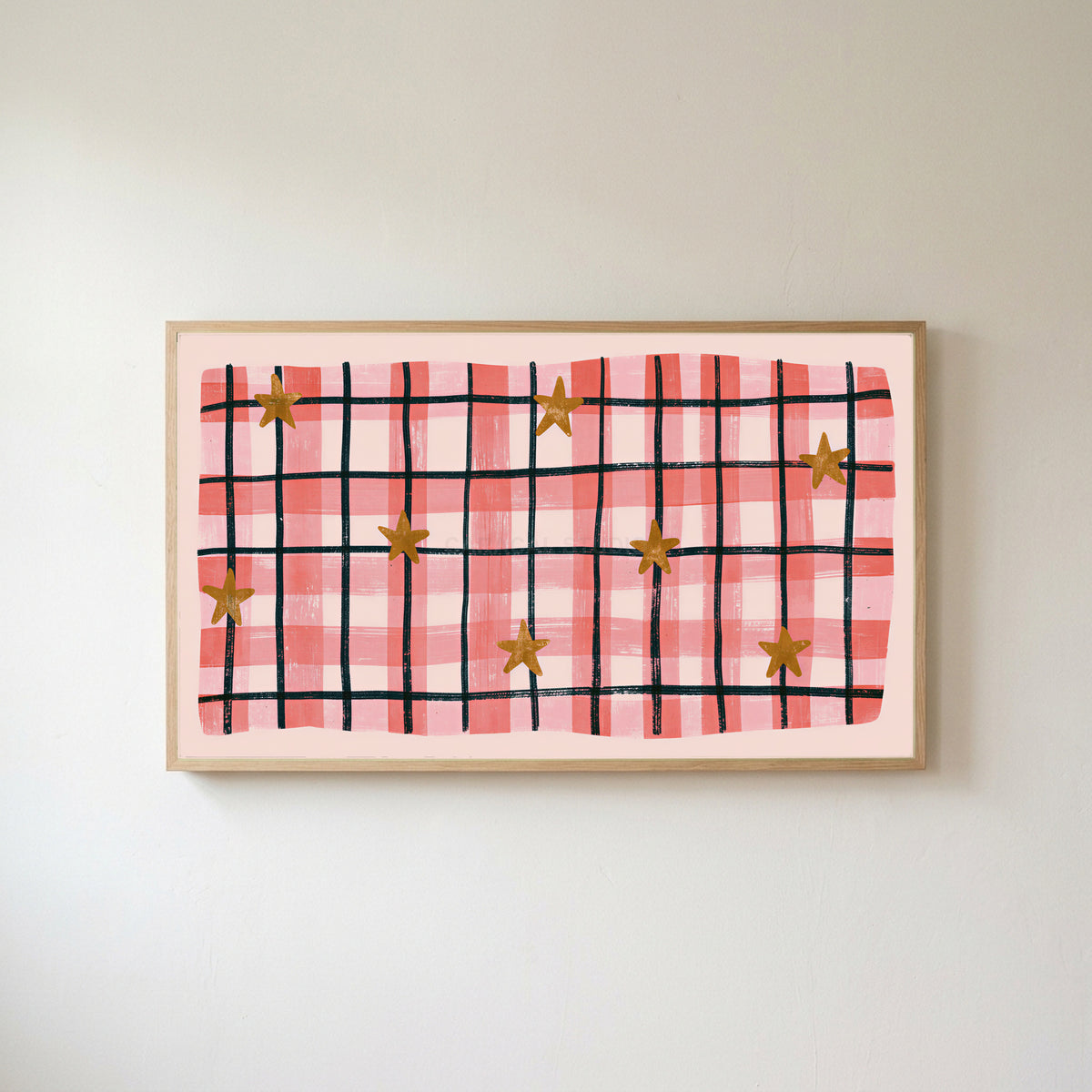 Gingham plaid with stars Frame TV art in an oak frame on a warm white wall