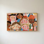 Smiling faces Frame TV art in an oak frame on a warm white wall