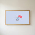Umbrella kitten Frame TV art in an oak frame on a warm white wall