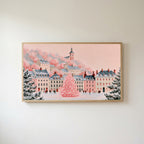 Pink Christmas village Frame TV art in an oak frame on a warm white wall