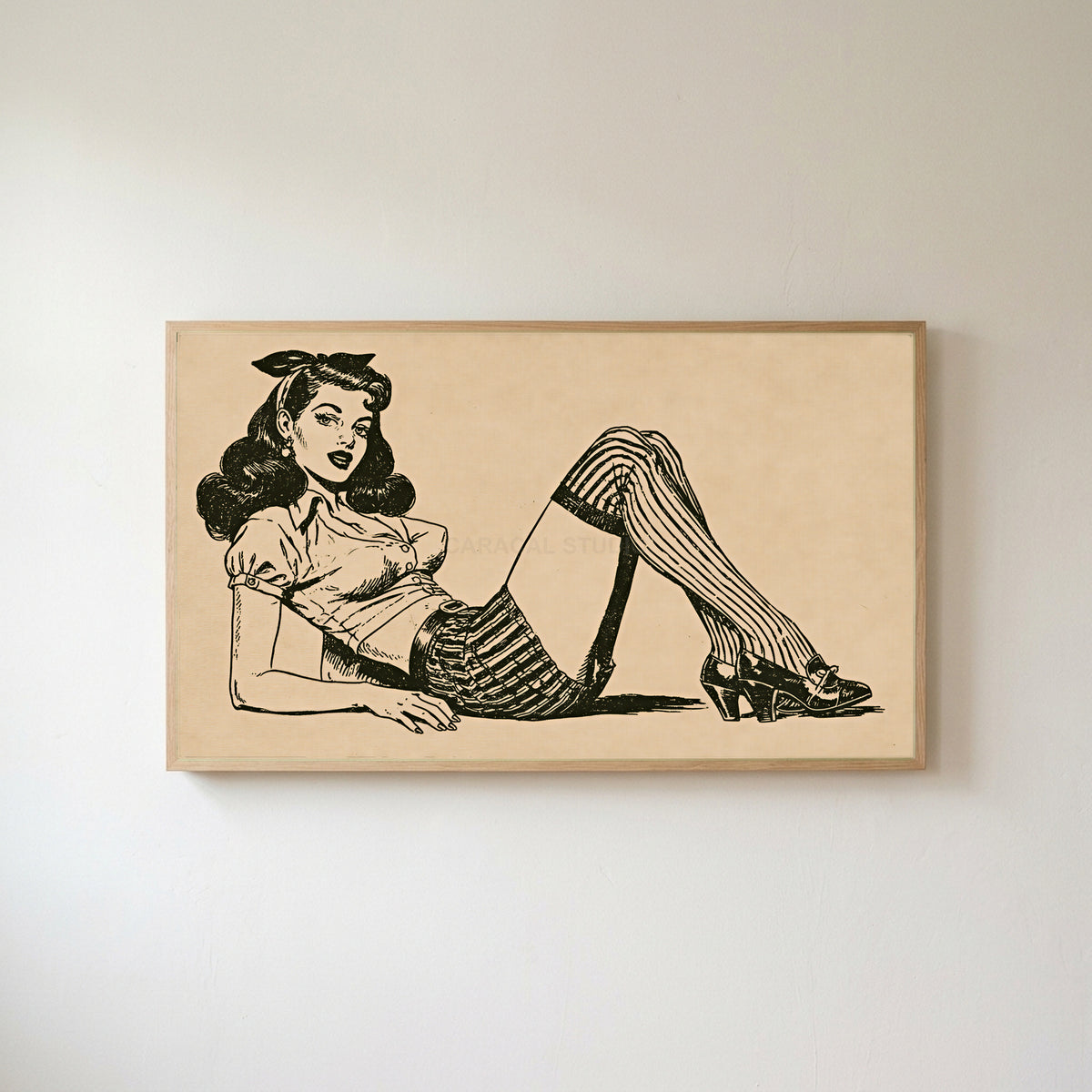 Vintage pin-up drawing Frame TV art in an oak frame on a warm white wall
