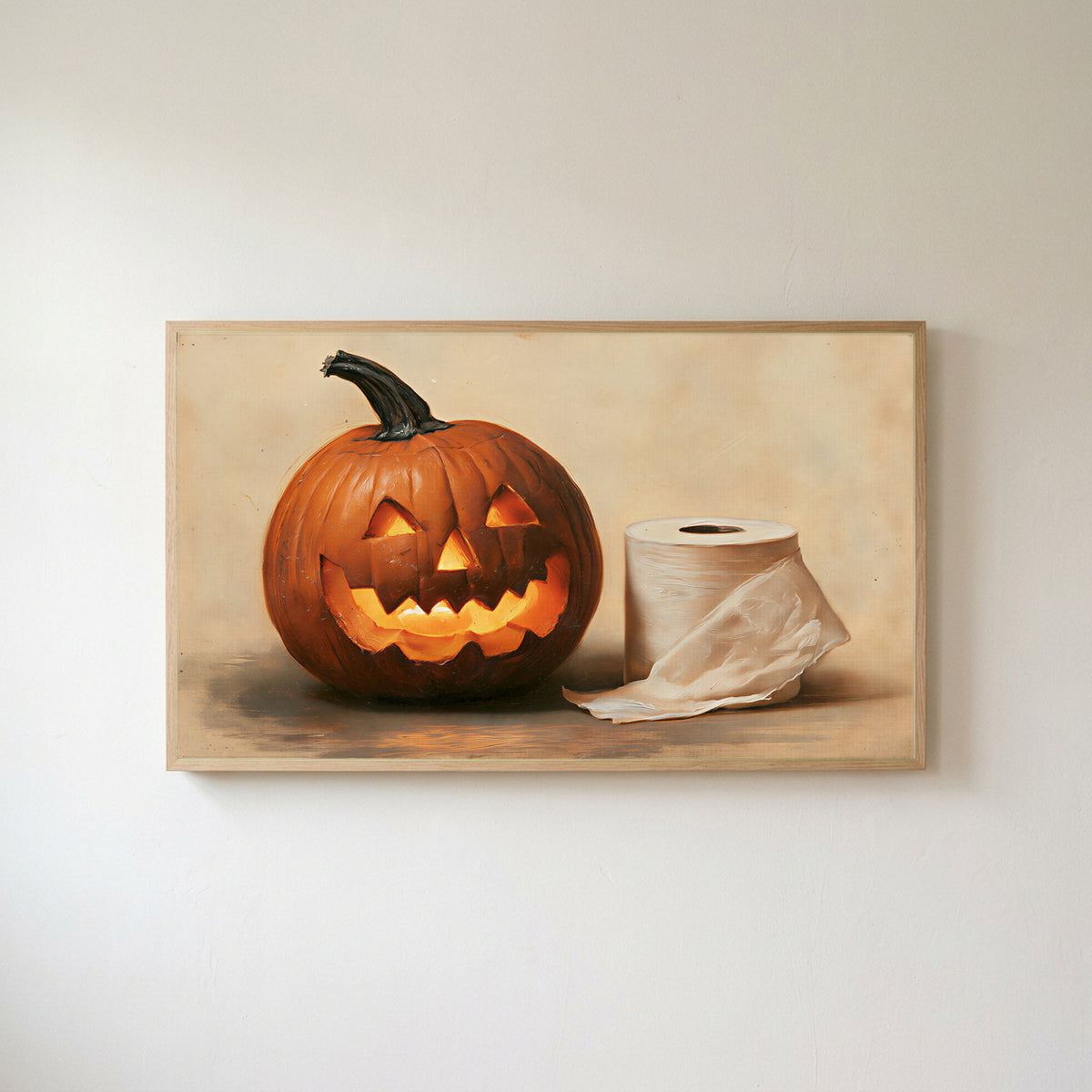 Jack-o'-lantern and toilet paper Frame TV art in an oak frame on a warm white wall