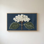 Embroidered hydrangea Frame TV art in an oak frame on a warm white wall