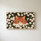 Ginger cat in daisies Frame TV art in an oak frame on a warm white wall