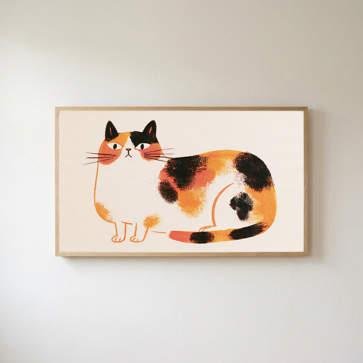 Calico cat Frame TV art in an oak frame on a warm white wall