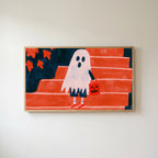 Ghost with a jack-o'-lantern bag Frame TV art in an oak frame on a warm white wall