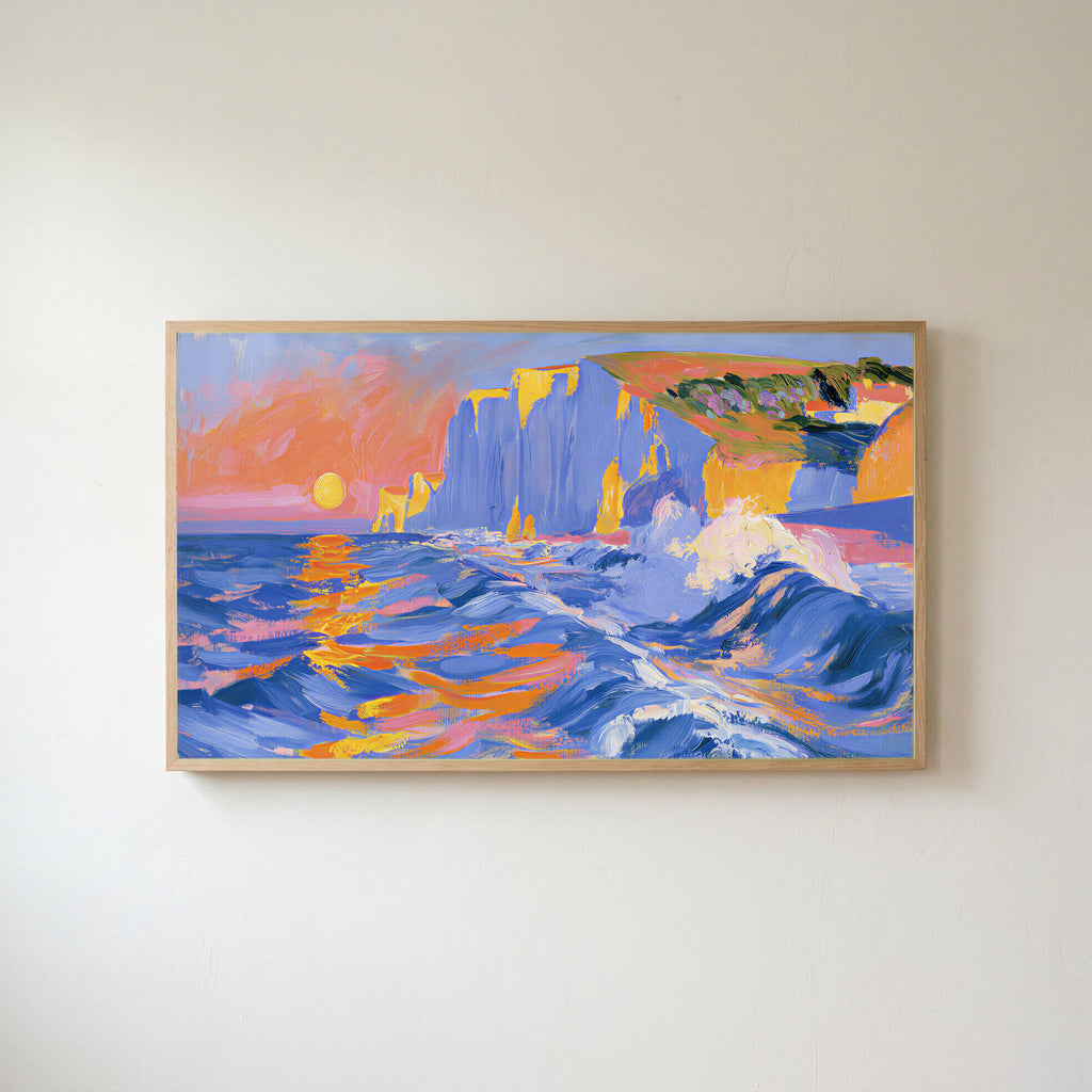 Sunset sea cliffs Frame TV art in an oak frame on a warm white wall