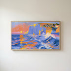 Sunset sea cliffs Frame TV art in an oak frame on a warm white wall