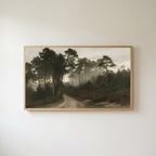 Misty pine forest path Frame TV art in an oak frame on a warm white wall