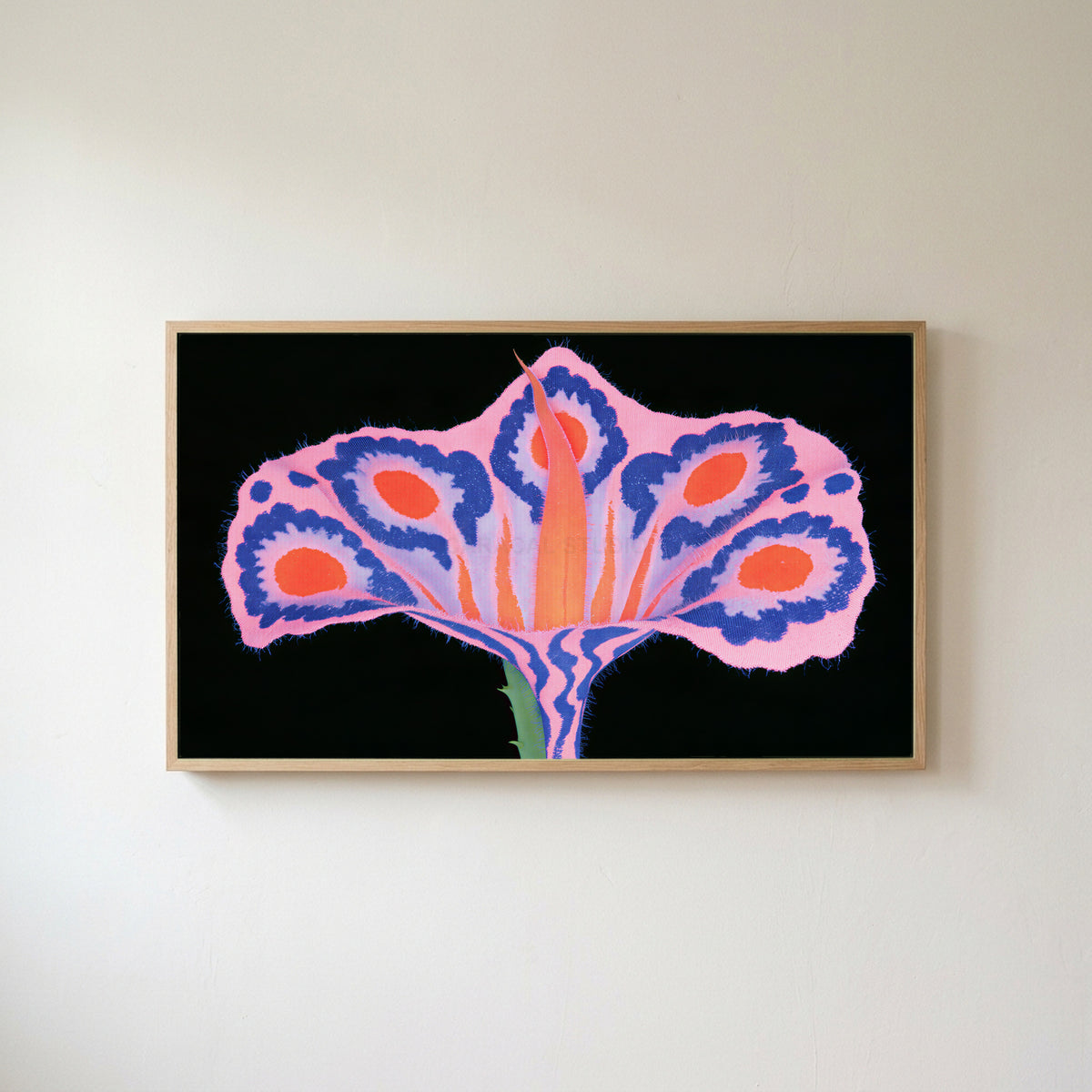 Surreal flower Frame TV art in an oak frame on a warm white wall