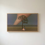 Storm field tree Frame TV art in an oak frame on a warm white wall