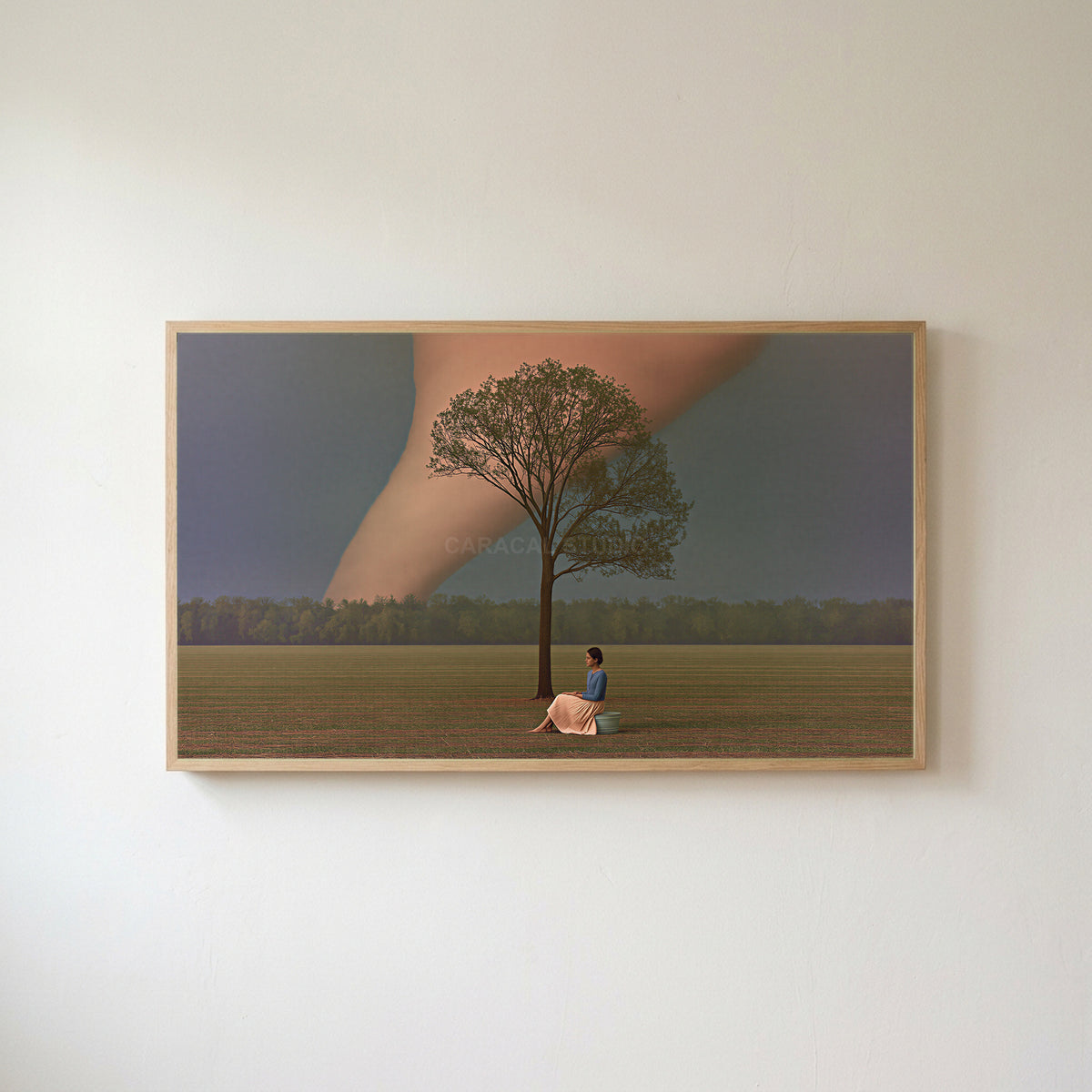 Storm field tree Frame TV art in an oak frame on a warm white wall