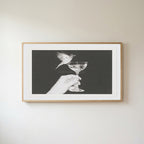 Bird and champagne glass Frame TV art in an oak frame on a warm white wall